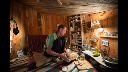 With his one spoon, one fork and one knife, Price prepares very simple meals. He adds oats, nuts and grains to whatever cereals are on sale, and since he doesn't have a refrigerator where he can store milk, he pours water on his cereal.