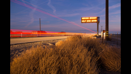 A sign advising water conservation greets drivers on California State Route 43 in Kern County, Calif. on Wed., Feb. 12.